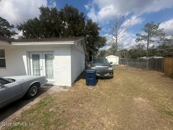 a view of a car parked in front of a house