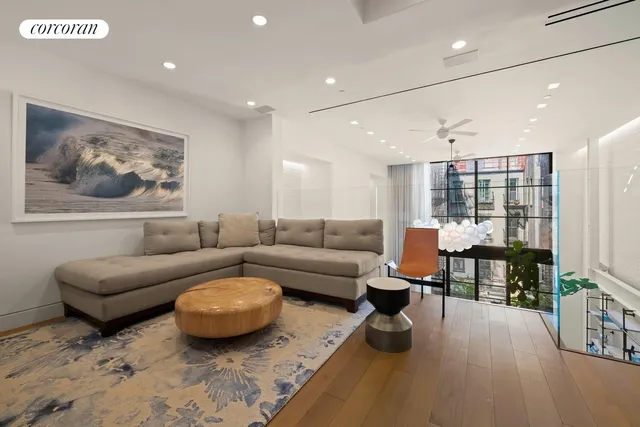 a bedroom with furniture and a potted plant