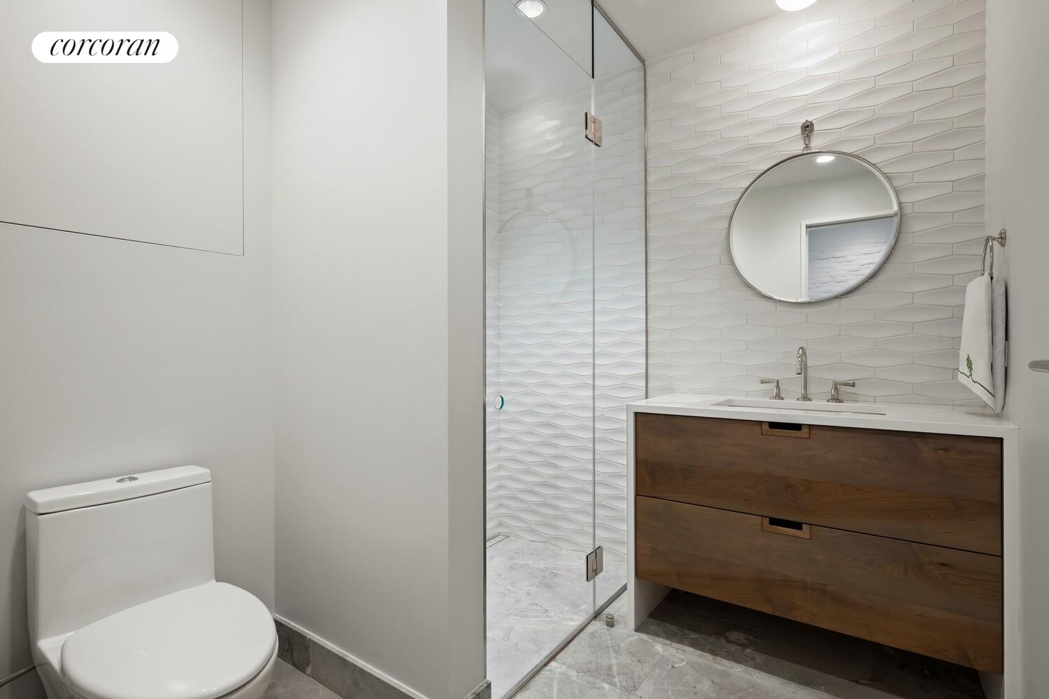 19 Jay Street Manhattan, NY 10013 - Photo 23 of 32 a bathroom with a toilet sink and mirror