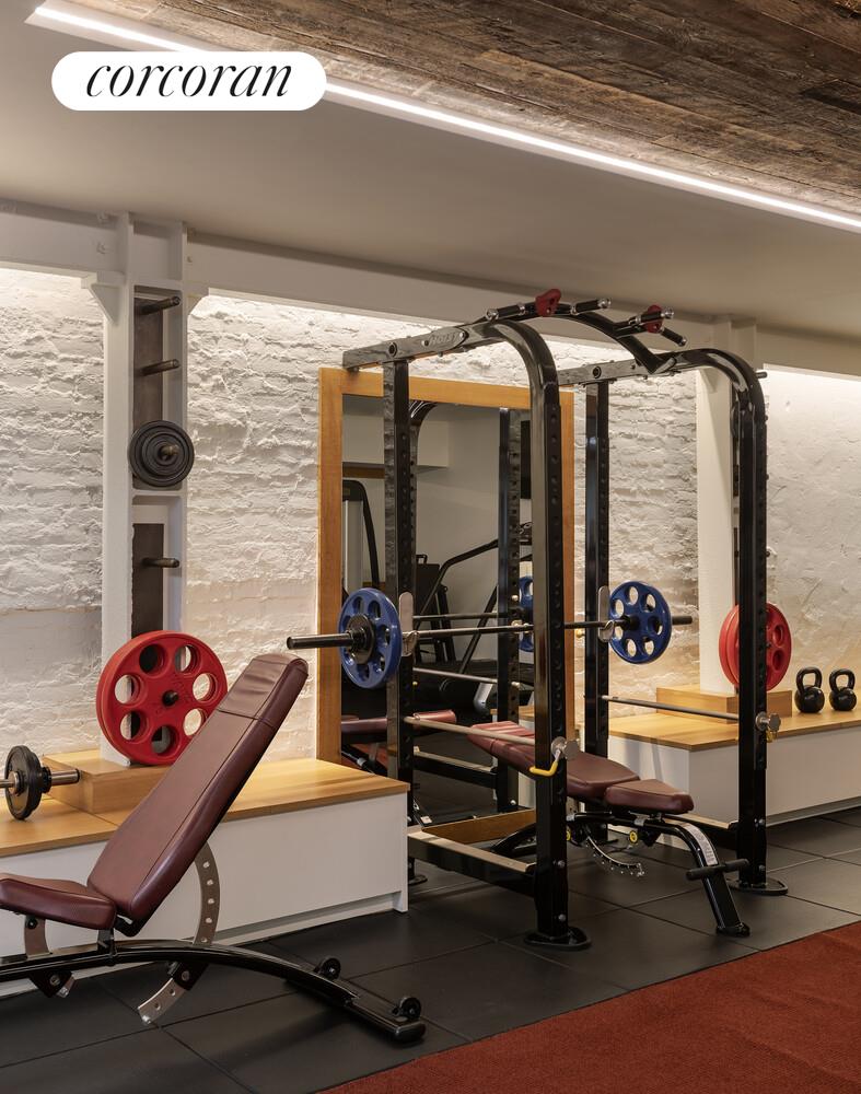 19 Jay Street Manhattan, NY 10013 - Photo 25 of 32 a room with gym equipment and a table