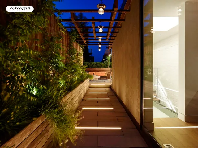 a view of a patio with a table and chairs