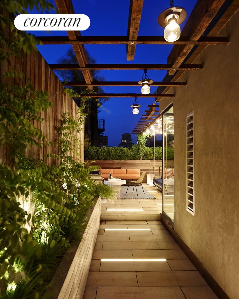 19 Jay Street Manhattan, NY 10013 - Photo 31 of 32 a view of a patio with a table and chairs