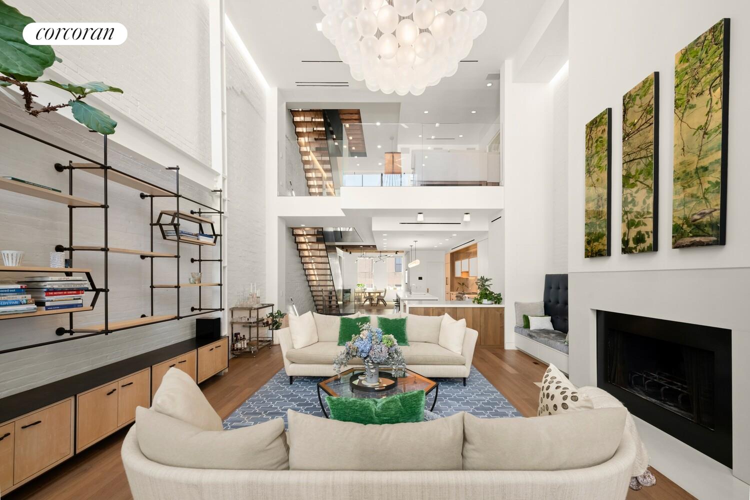 19 Jay Street Manhattan, NY 10013 - Photo 3 of 32 a living room with furniture and a fireplace