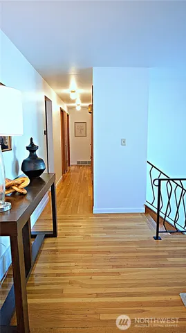 a view of a hallway with seating area
