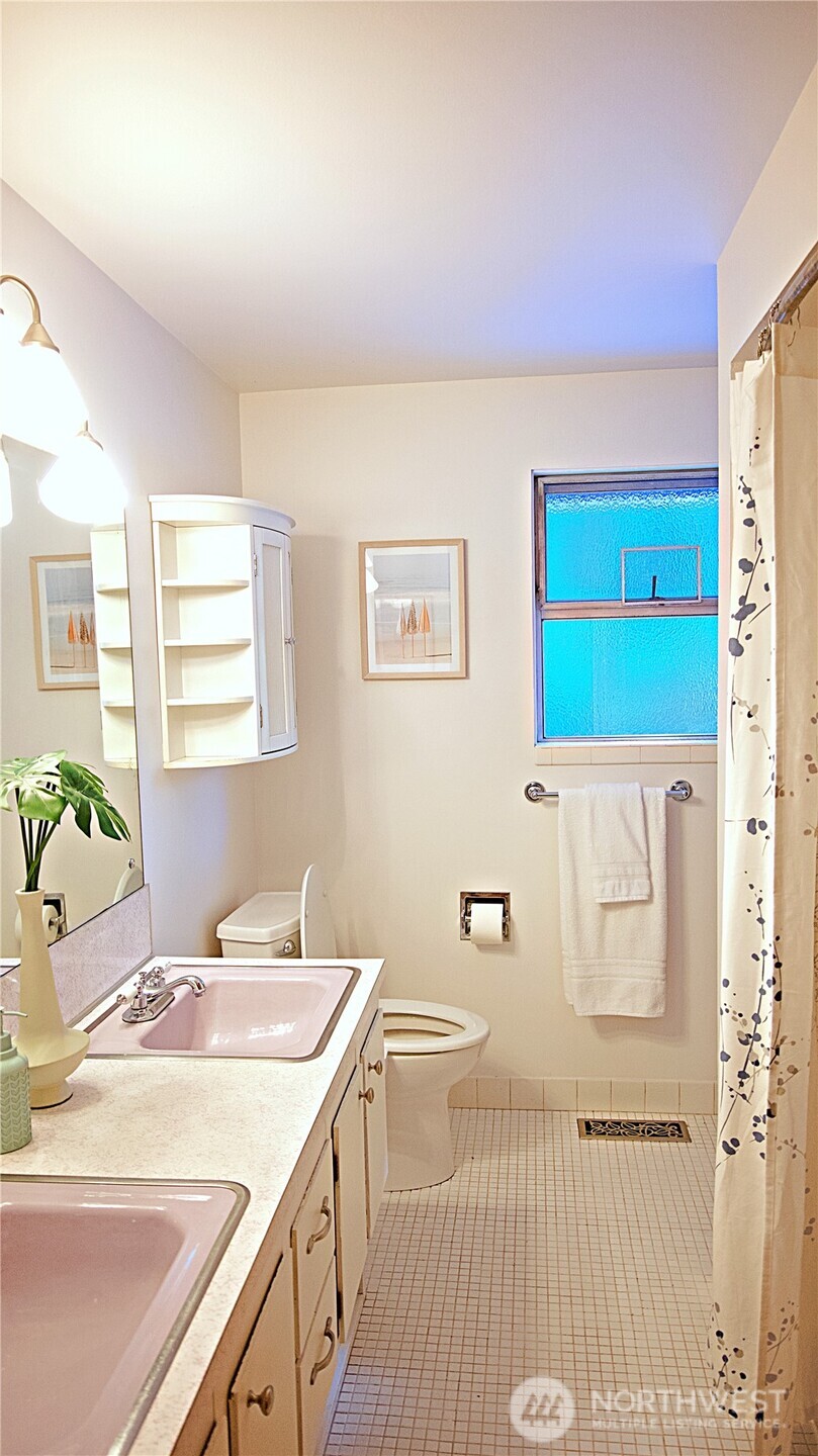 16 234th Place Southeast Bothell, WA 98021 - Photo 12 of 36 a bathroom with a sink a mirror and a bathtub