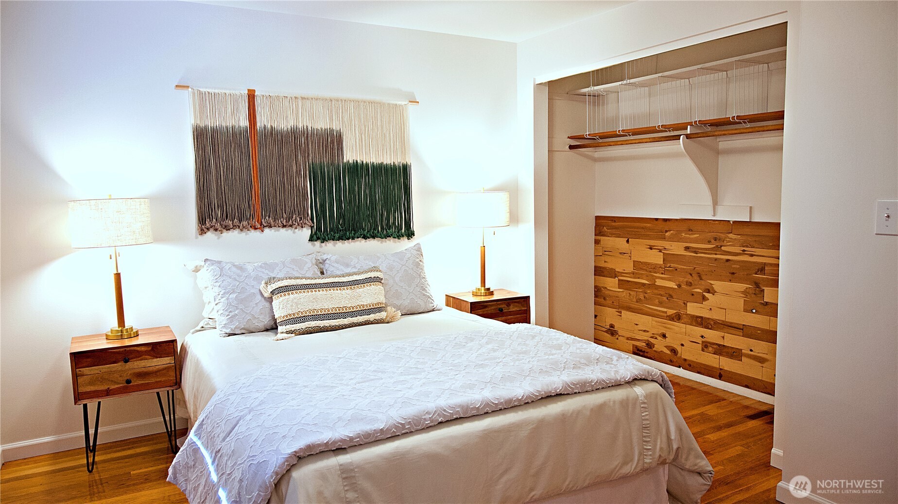 16 234th Place Southeast Bothell, WA 98021 - Photo 13 of 36 a bedroom with a bed and a flat tv screen on a dresser