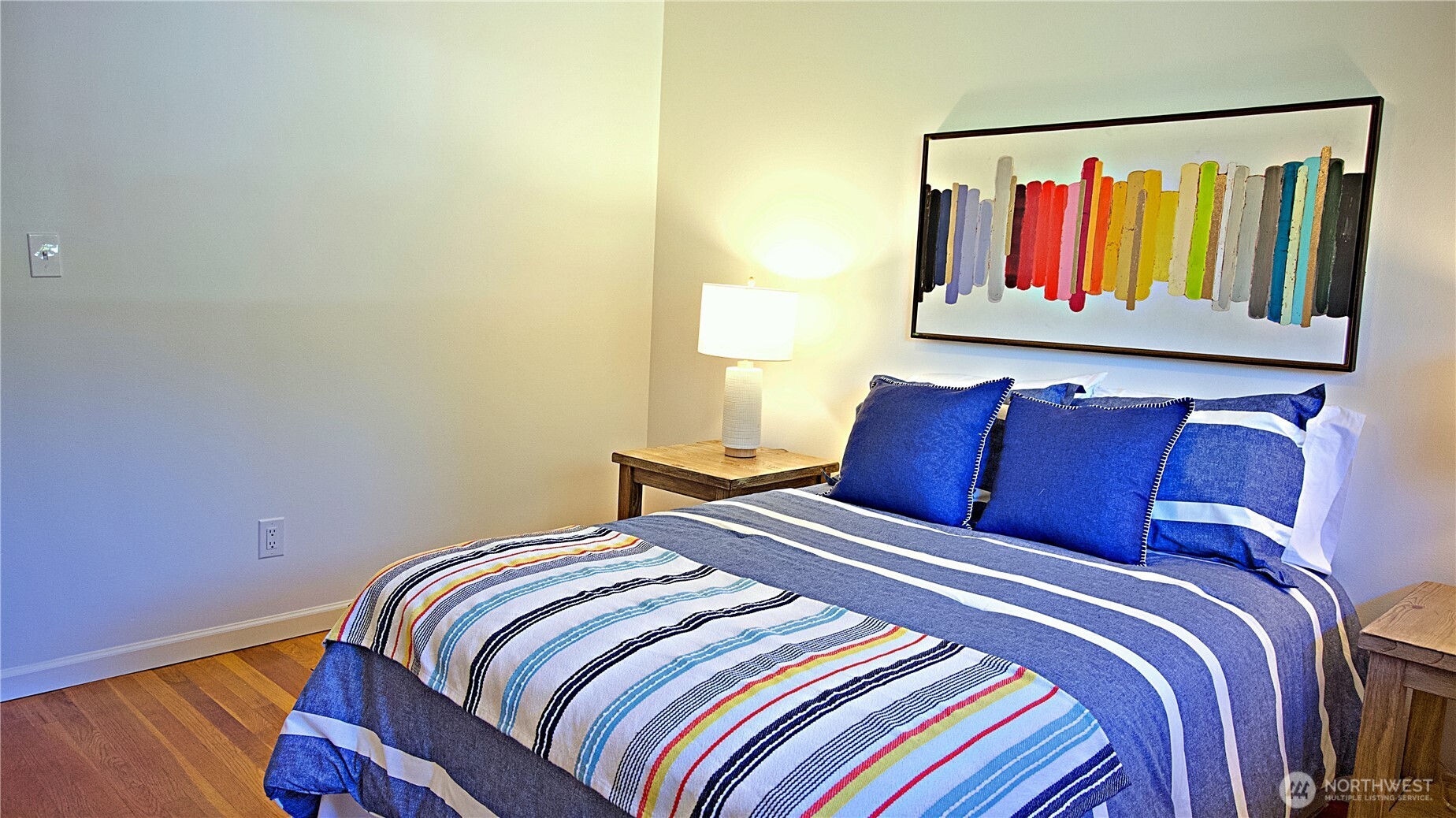 16 234th Place Southeast Bothell, WA 98021 - Photo 16 of 36 a bedroom with a bed and a painting on the wall