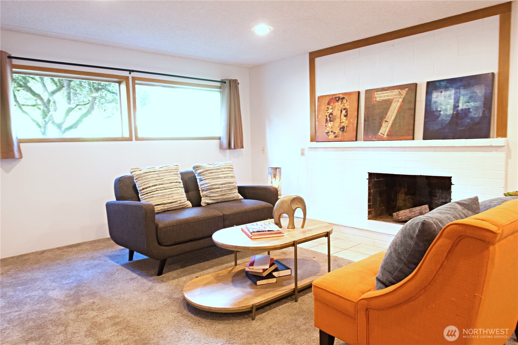 16 234th Place Southeast Bothell, WA 98021 - Photo 19 of 36 a living room with furniture and a fireplace