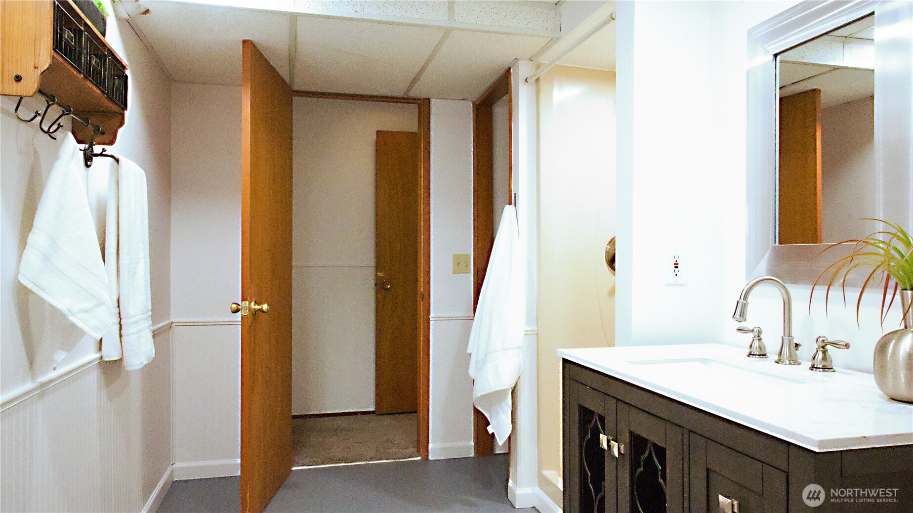 16 234th Place Southeast Bothell, WA 98021 - Photo 27 of 36 a bathroom with a sink and a mirror