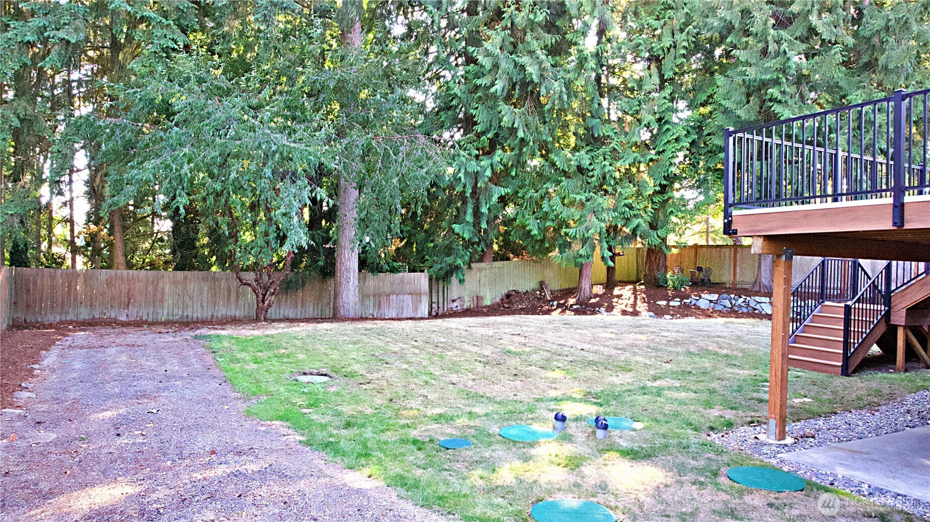 16 234th Place Southeast Bothell, WA 98021 - Photo 29 of 36 a view of a backyard with table and chairs and potted plants