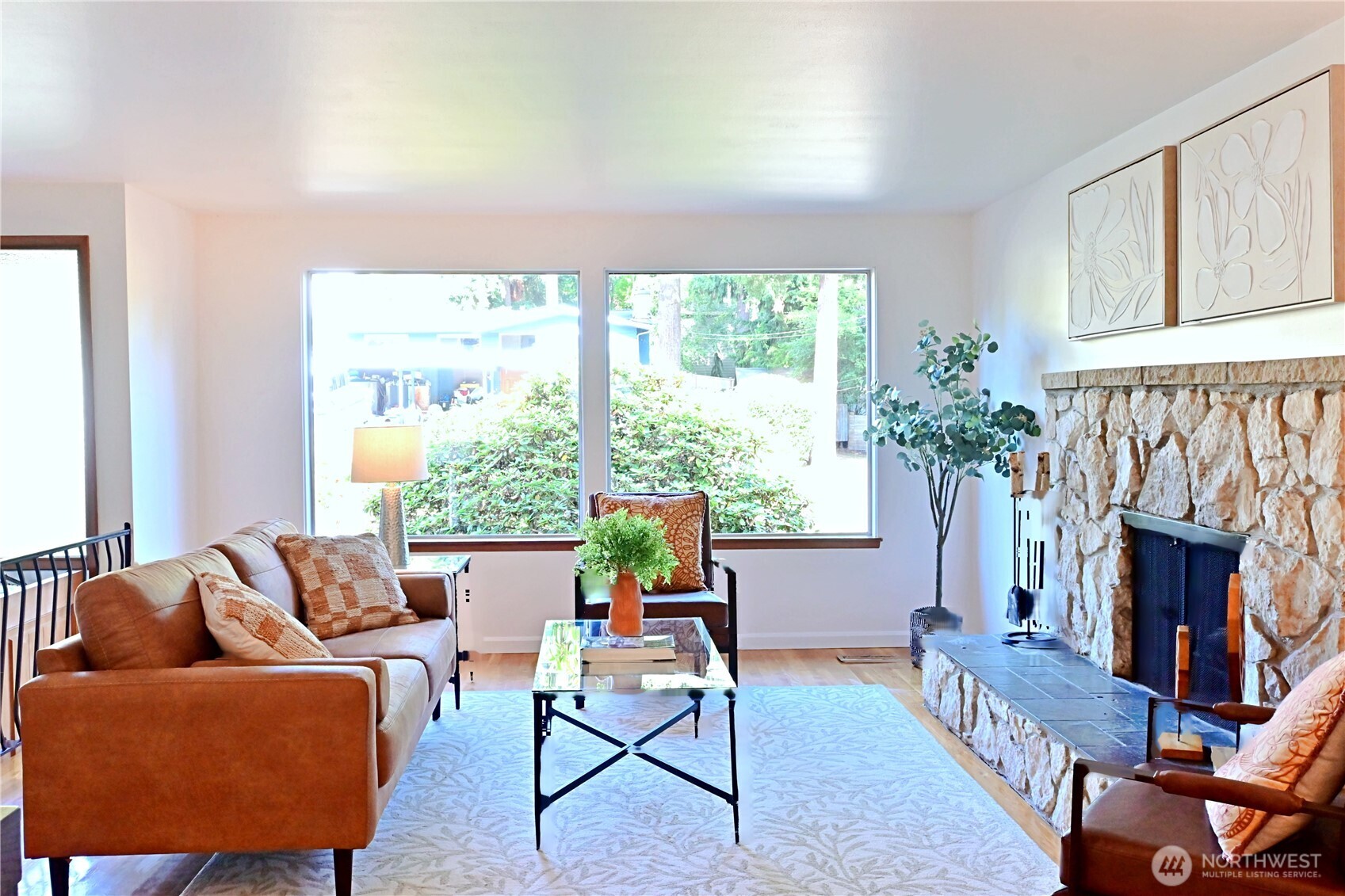 16 234th Place Southeast Bothell, WA 98021 - Photo 3 of 36 a living room with furniture a fireplace and a window