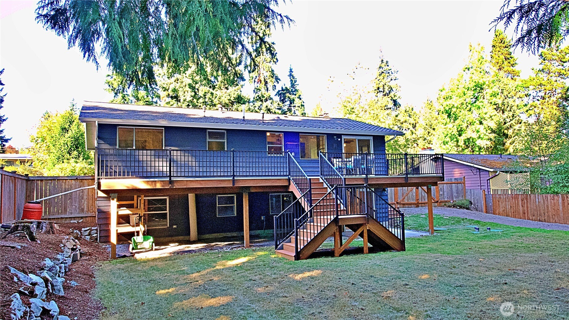 16 234th Place Southeast Bothell, WA 98021 - Photo 31 of 36 a view of a house with a yard patio and a slide