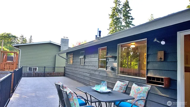 a backyard of a house with seating space
