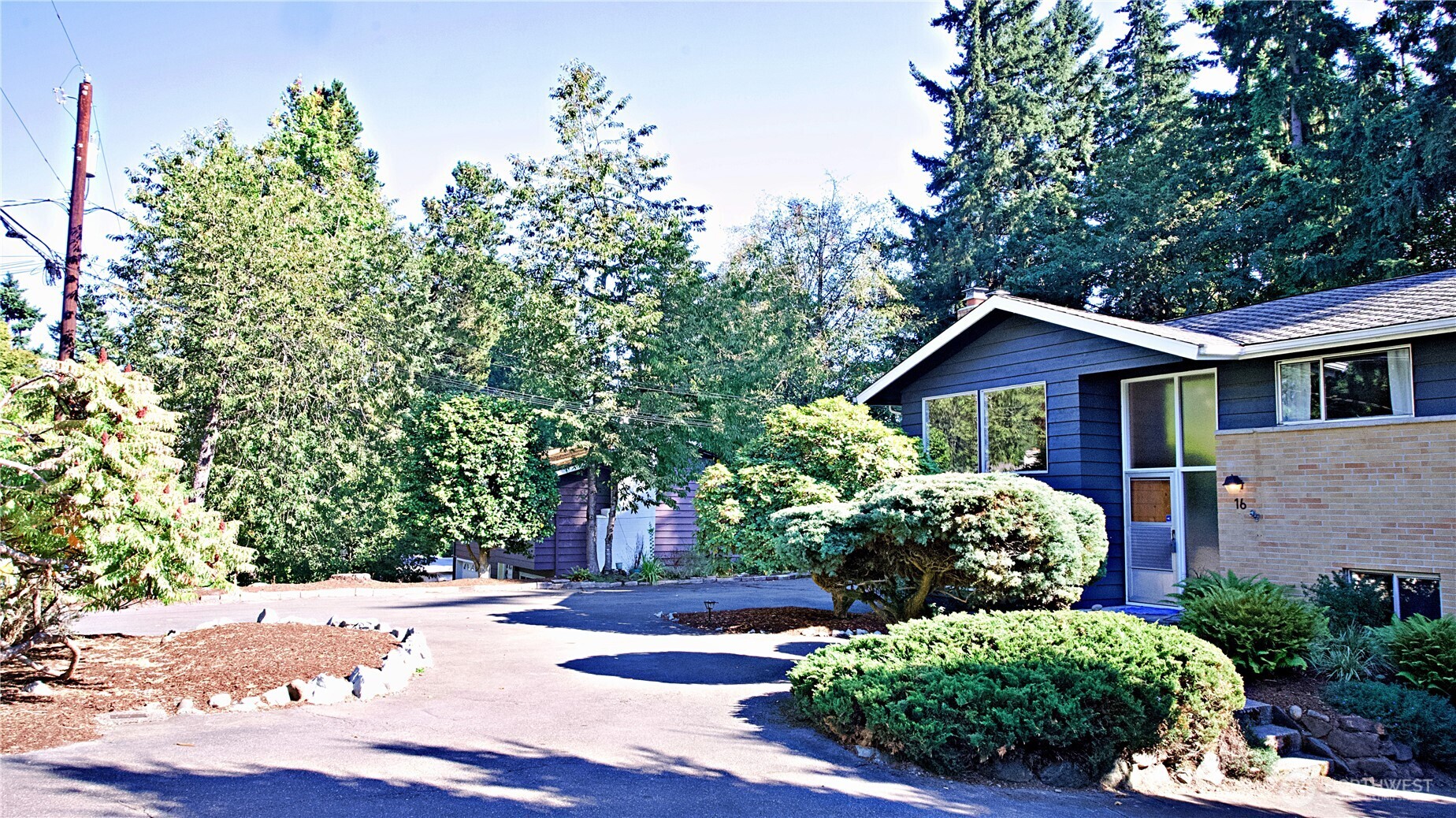 16 234th Place Southeast Bothell, WA 98021 - Photo 36 of 36 a front view of a house with a yard and garage