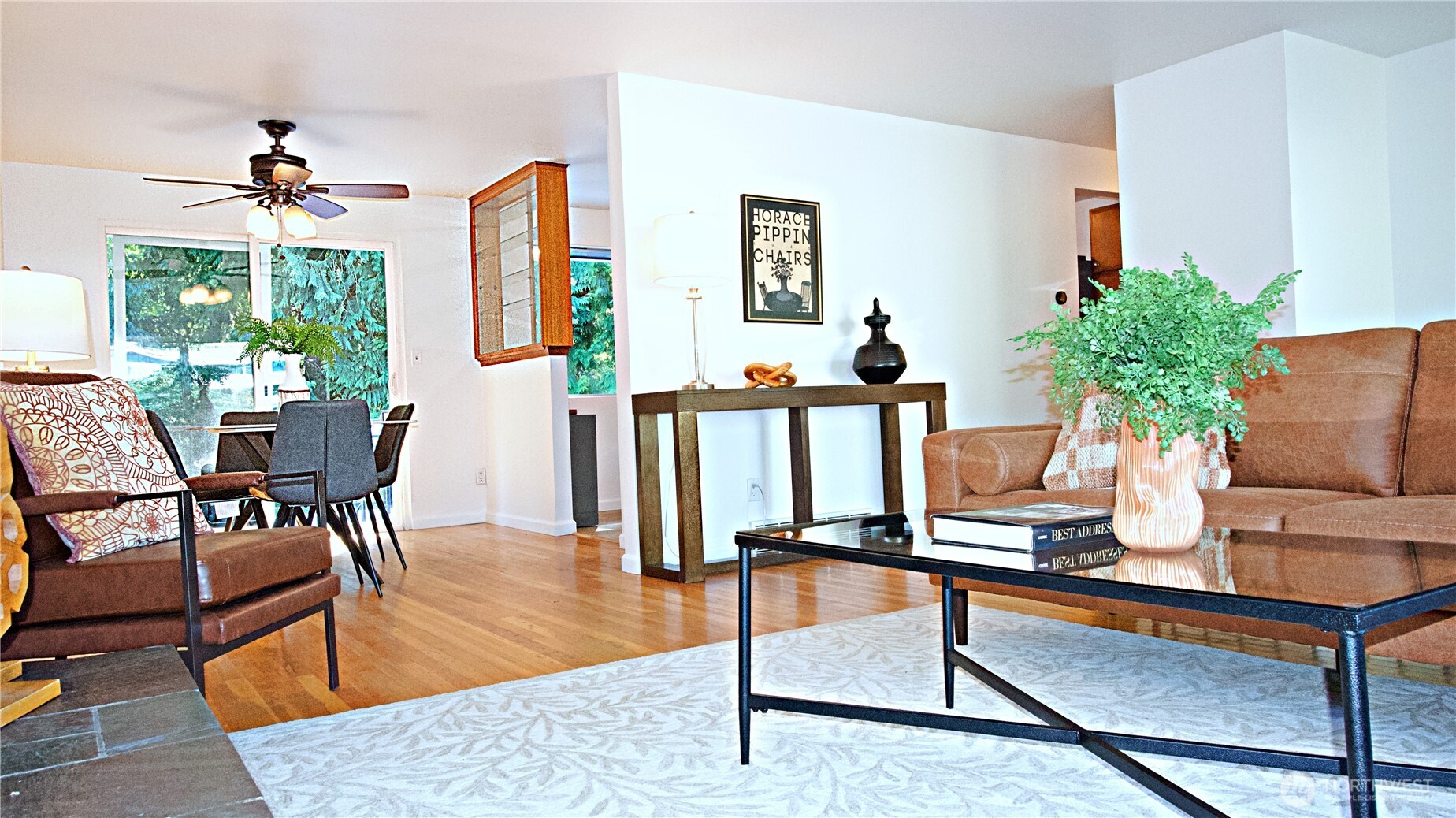 16 234th Place Southeast Bothell, WA 98021 - Photo 5 of 36 a living room with furniture a flat screen tv and a large window