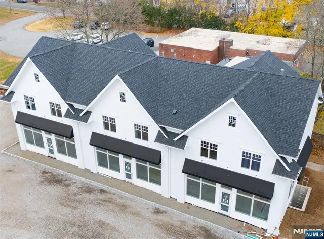a view of a white building among the street