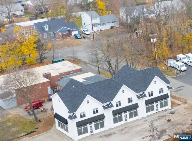 a view of multiple houses with a yard