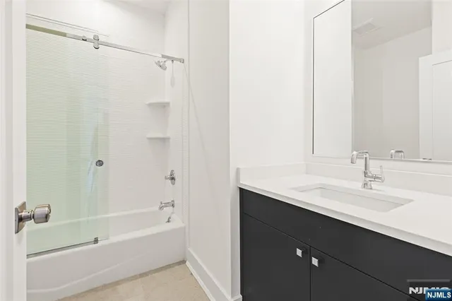 a bathroom with a sink and a bathtub