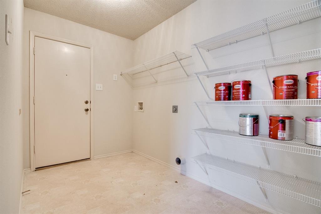 8211 Leaning Oak Court Arlington, TX 76002 - Photo 15 of 26 Laundry area with a textured ceiling, light flooring, washer hookup, and electric dryer hookup