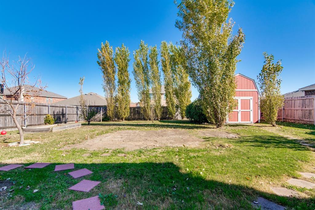 8211 Leaning Oak Court Arlington, TX 76002 - Photo 23 of 26 Fenced backyard with a storage shed