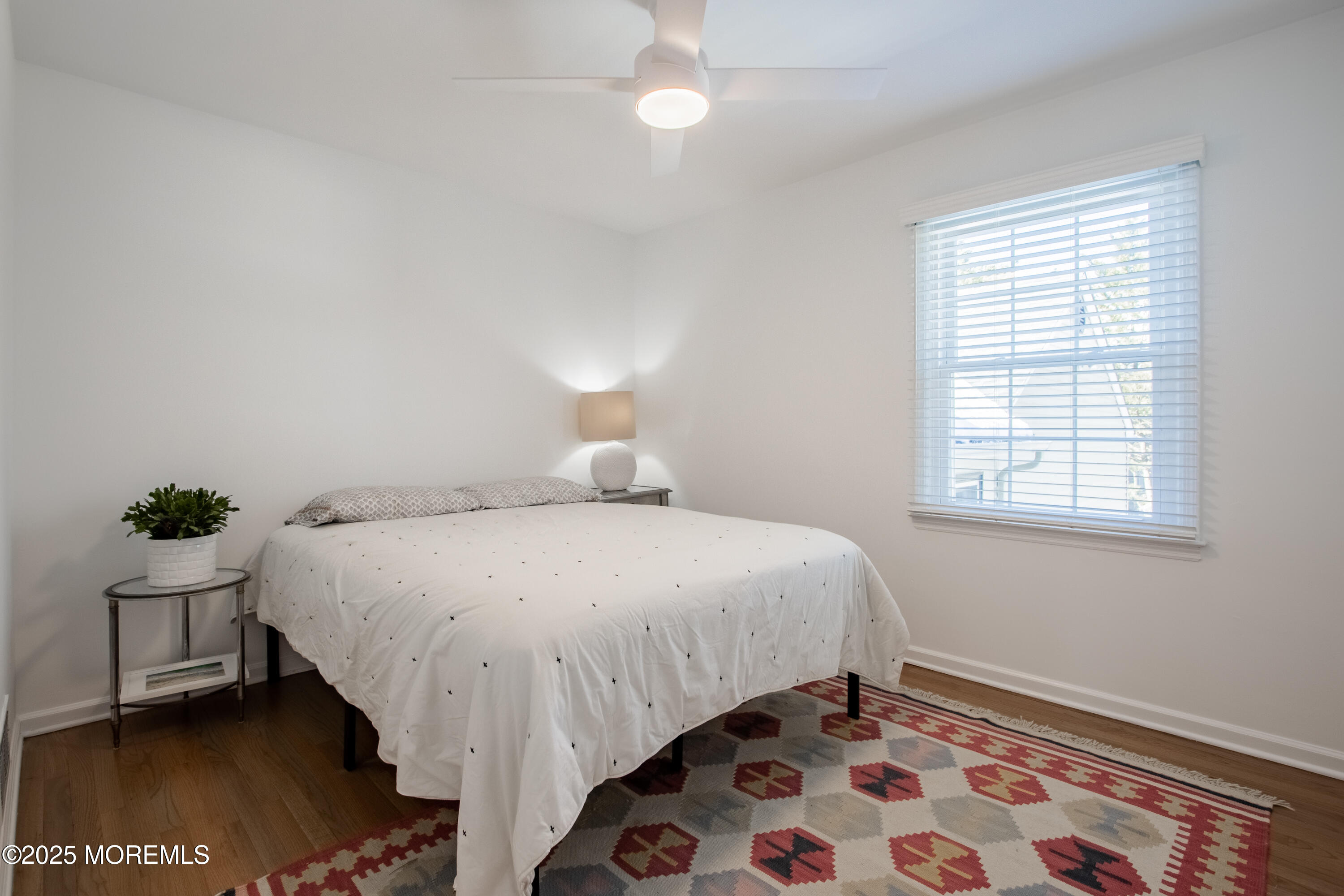 60 Brookside Lane Little Silver, NJ 07739 - Photo 16 of 34 a bedroom with a bed and a lamp