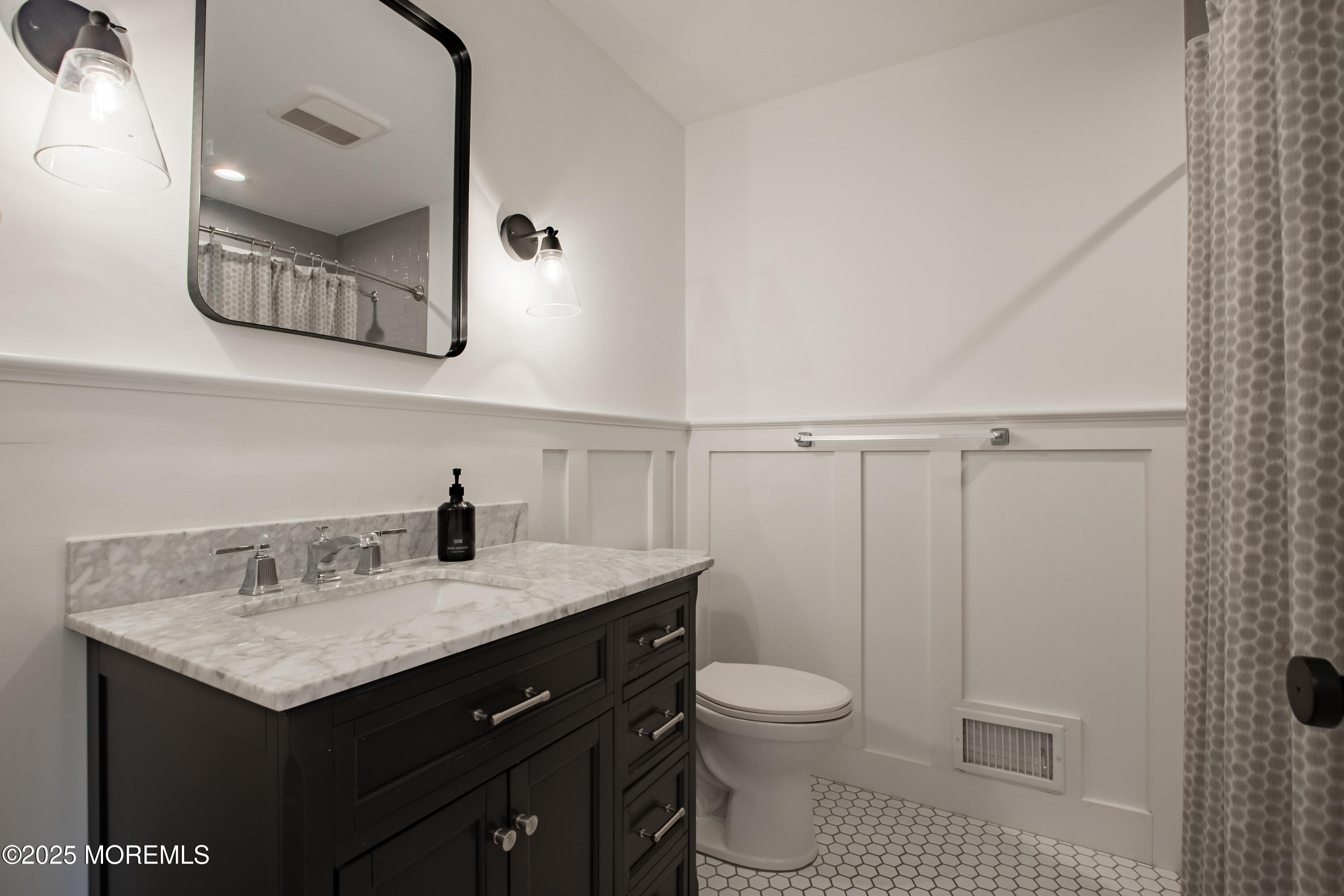 60 Brookside Lane Little Silver, NJ 07739 - Photo 17 of 34 a bathroom with a sink a toilet and mirror