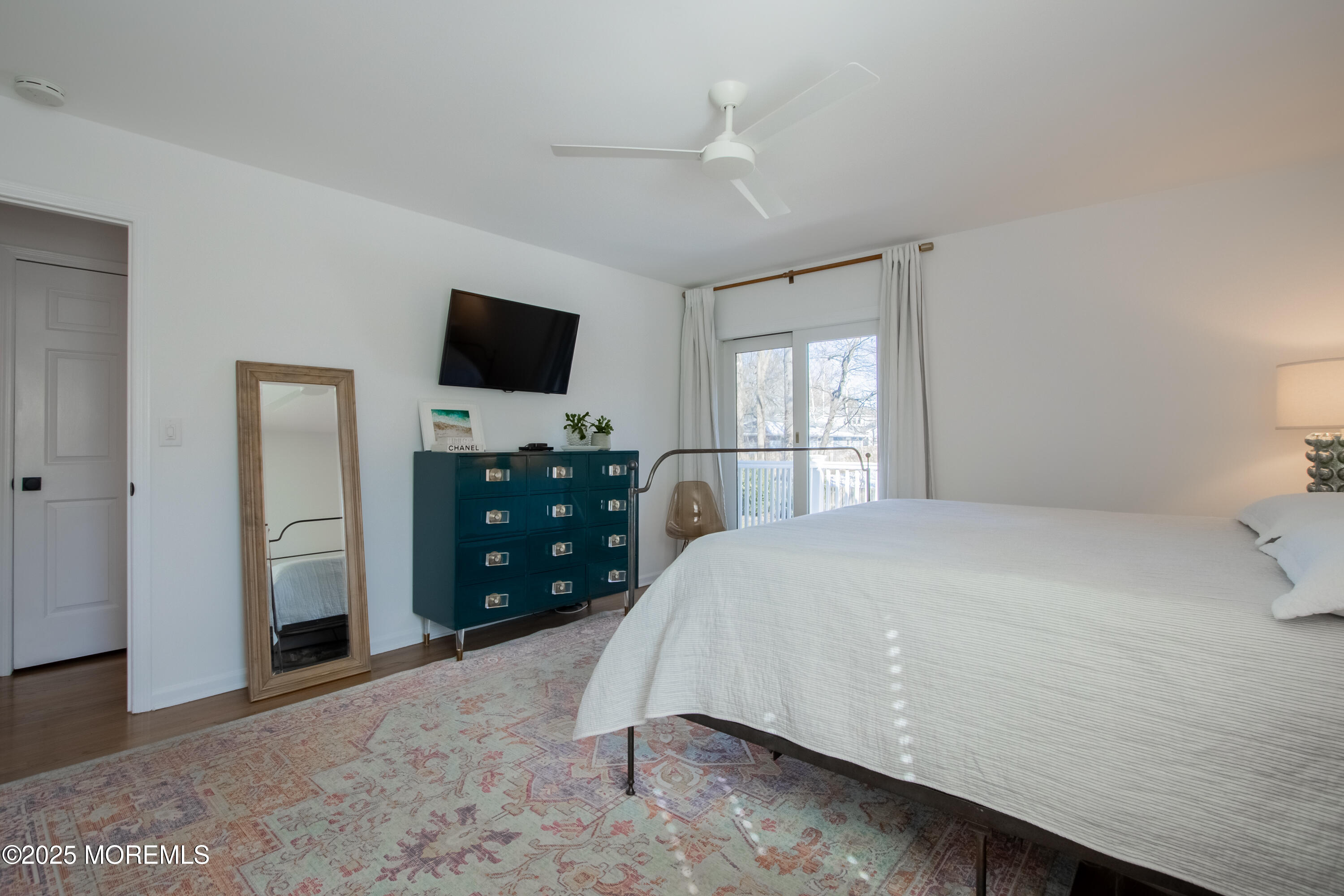60 Brookside Lane Little Silver, NJ 07739 - Photo 21 of 34 a spacious bedroom with a bed and a flat screen tv