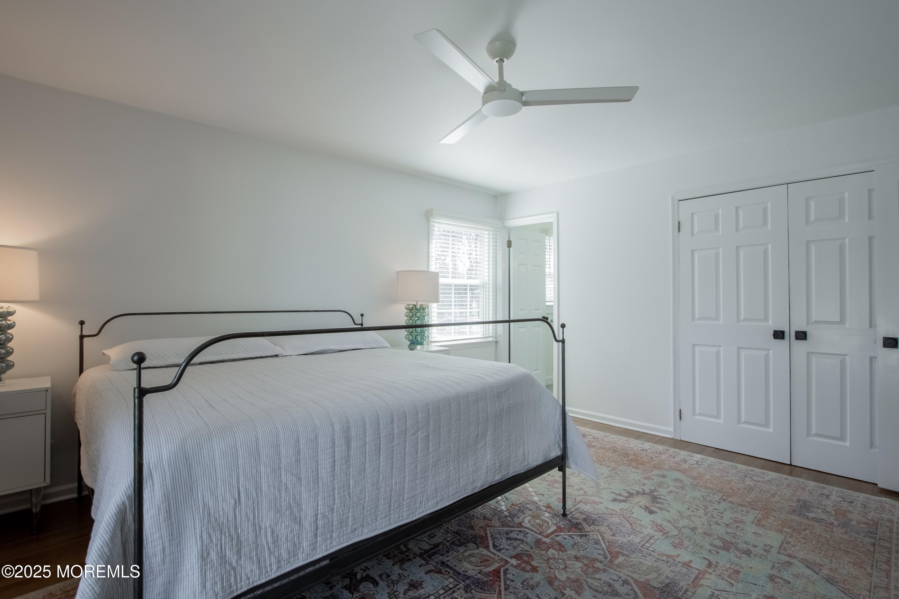 60 Brookside Lane Little Silver, NJ 07739 - Photo 22 of 34 a room with a bed and a ceiling fan