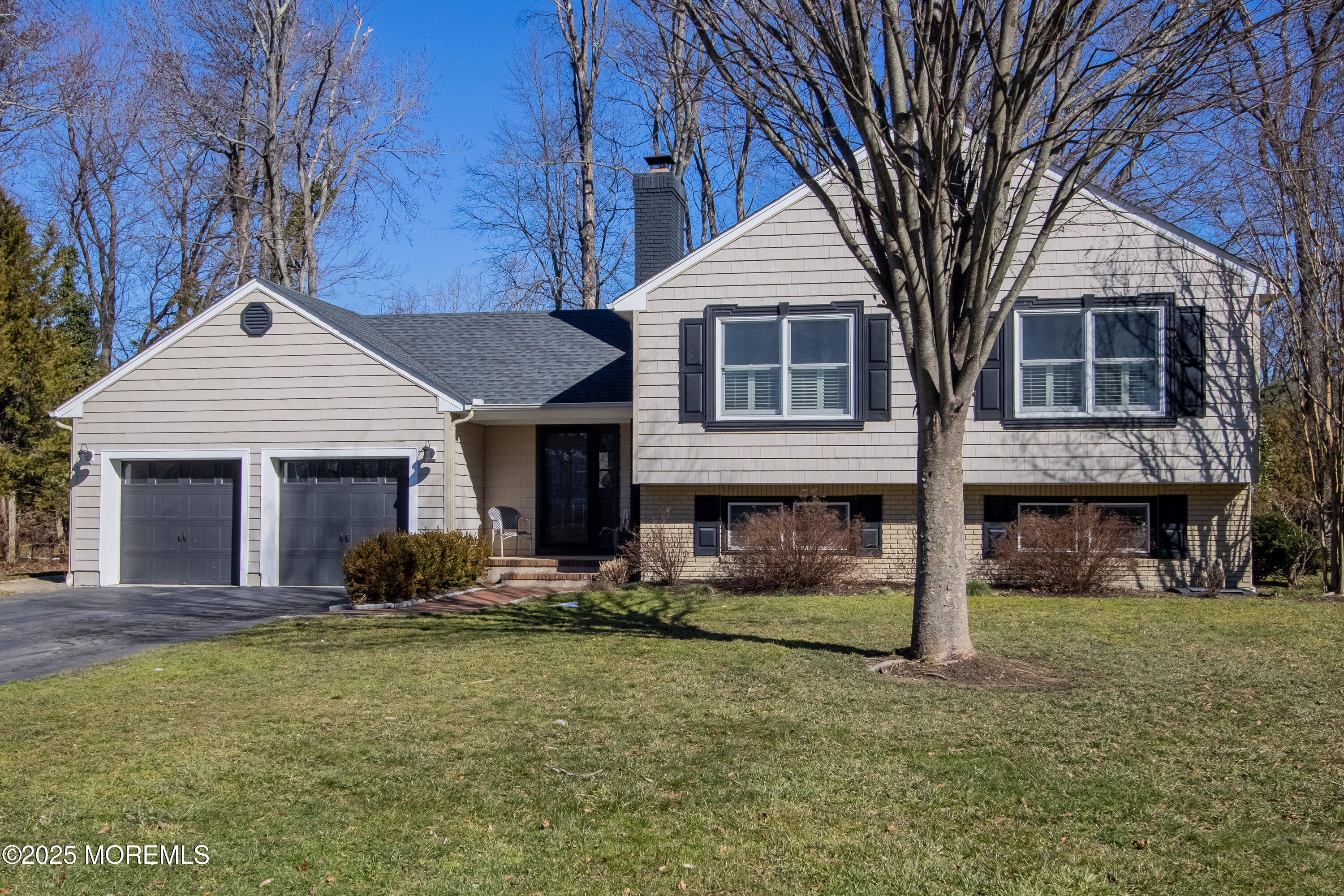60 Brookside Lane Little Silver, NJ 07739 - Photo 3 of 34 a front view of a house with a yard