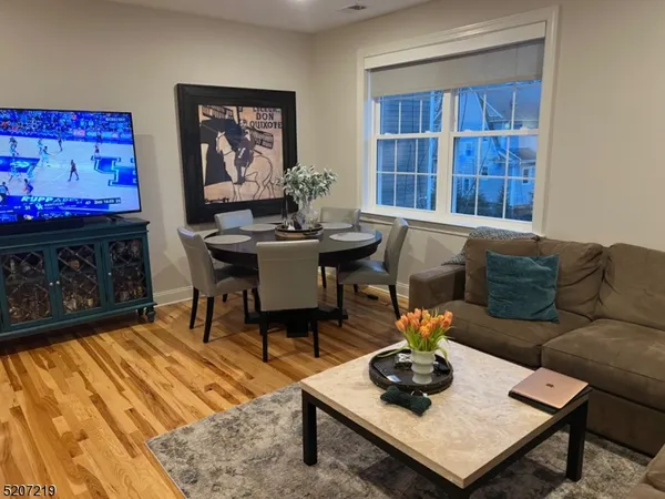 a bed room with a bed and a chair