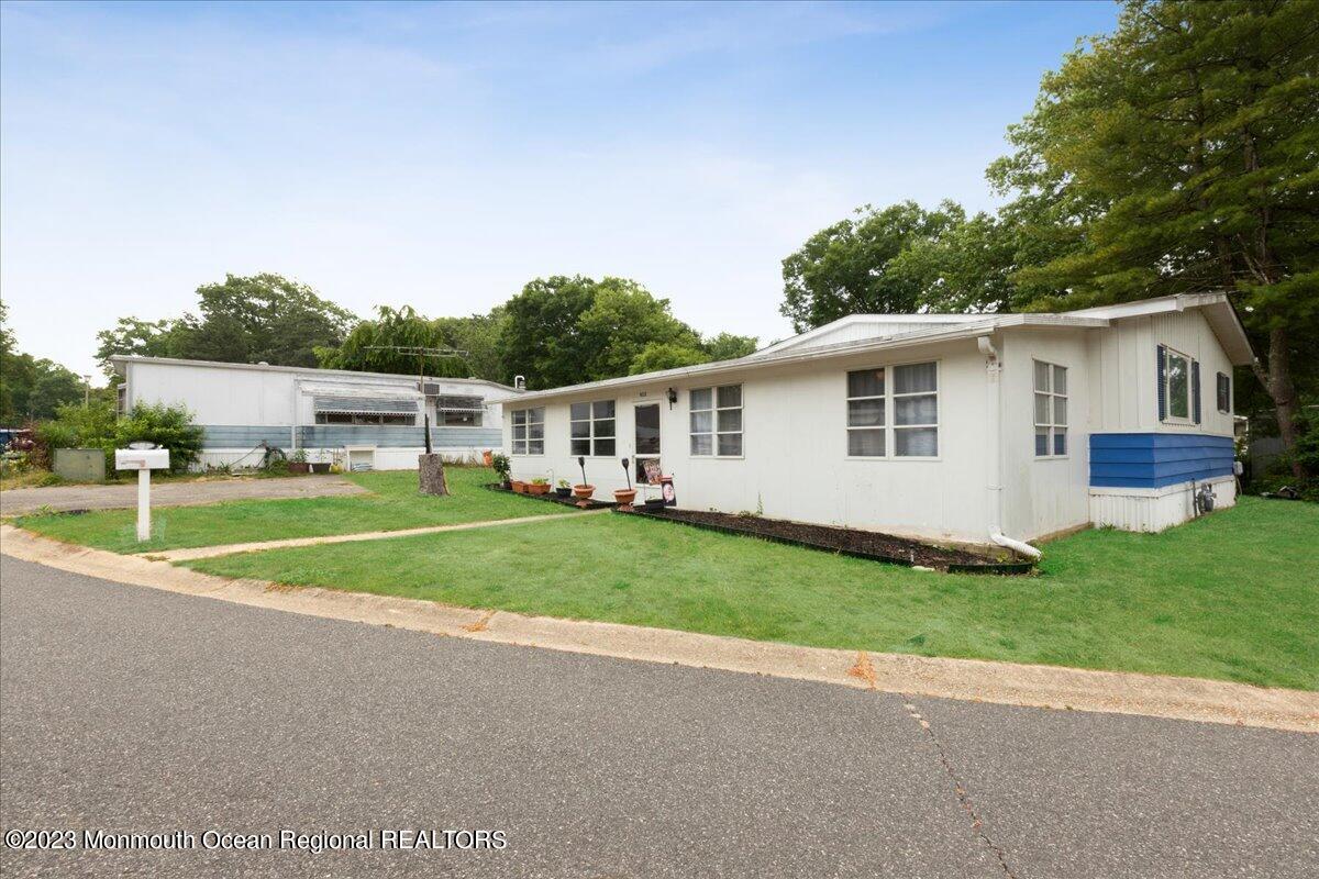 422 Roberts Road Toms River, NJ 08755 - Photo 3 of 18 a view of a house with a backyard and a patio