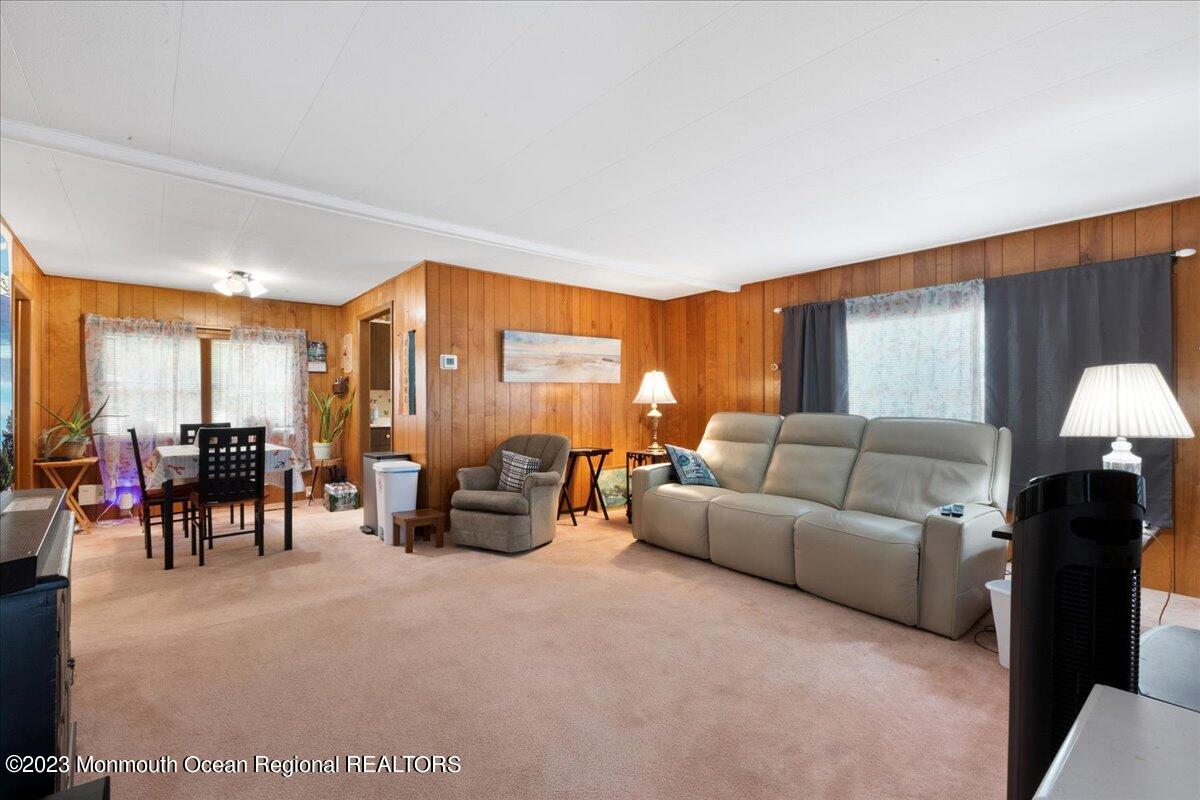 422 Roberts Road Toms River, NJ 08755 - Photo 9 of 18 a living room with furniture and a flat screen tv