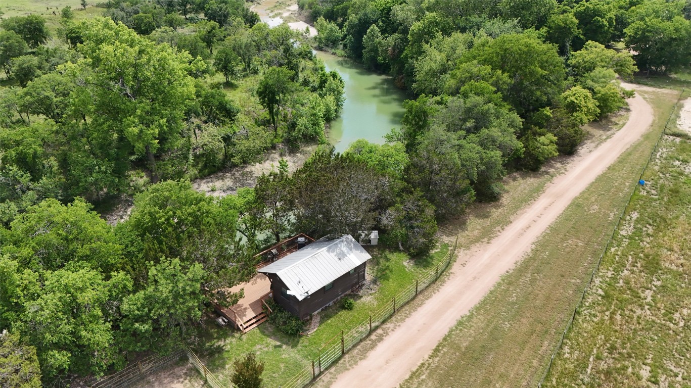 835 County Road 256 Liberty Hill, TX 78642 - Photo 16 of 34 Aerial view of property and surrounding area with a nearby body of water