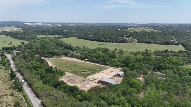 an aerial view of residential house with outdoor space and river