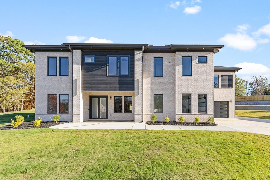 a front view of building with yard