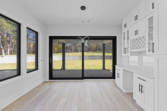 wooden floor in an empty room with a fireplace