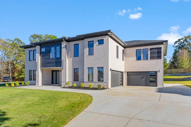 a front view of a house with a yard