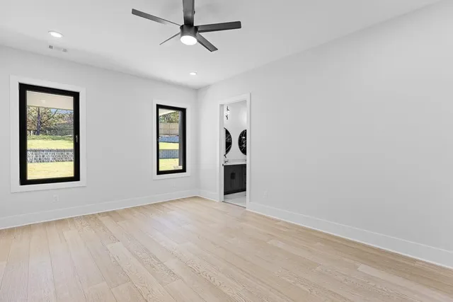 a bathroom with a double vanity sink mirror and bathtub