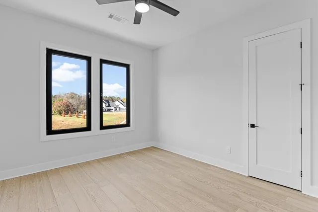 a bathroom with a sink a mirror and a toilet