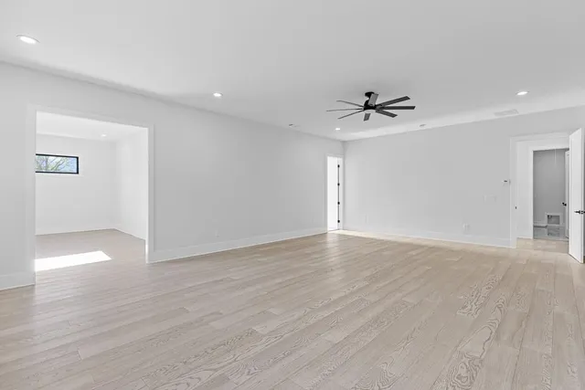 a bath tub sitting in a bathroom next to a sink