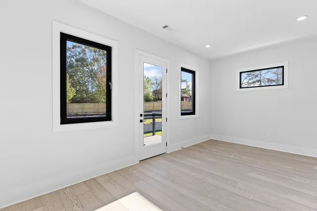a view of balcony with wooden floor and fence