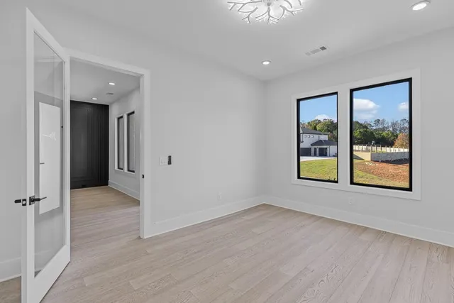 a large kitchen with stainless steel appliances lots of counter space and a sink