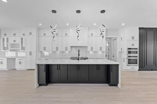 a large kitchen with cabinets