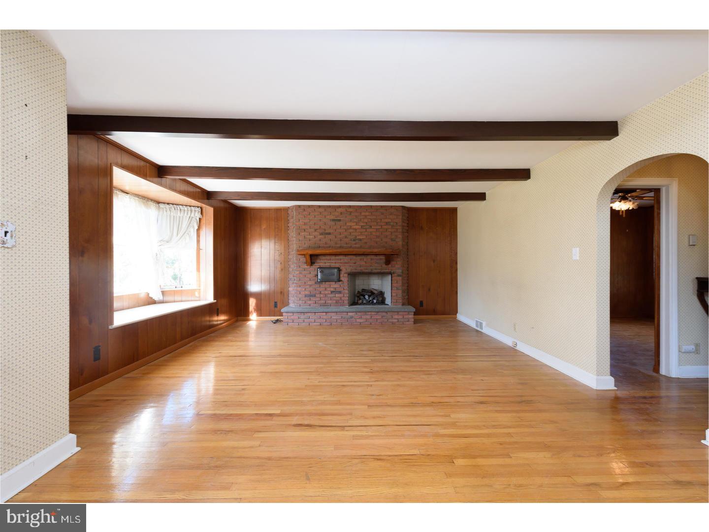 505 Bonsall Road Ridley Park, PA 19078 - Photo 3 of 20 a view of empty room with wooden floor and fan