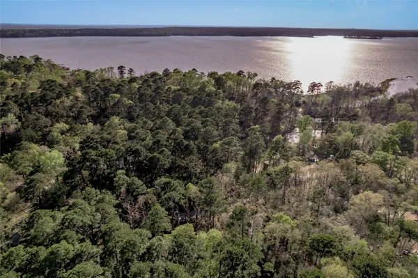 a aerial view of a house with a lake view