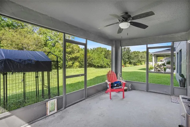 a front view of a house with garden and trees