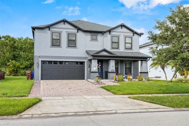 a view of a house with a yard and plants
