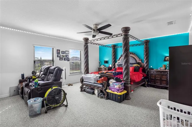 a bedroom with furniture and a window