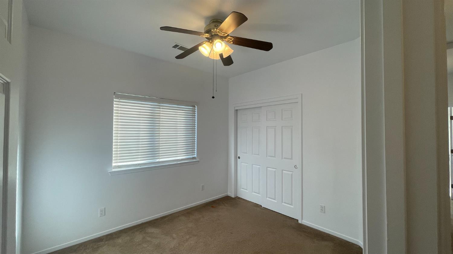 1400 Bay Street Lemoore, CA 93245 - Photo 12 of 21 a view of an empty room with a window