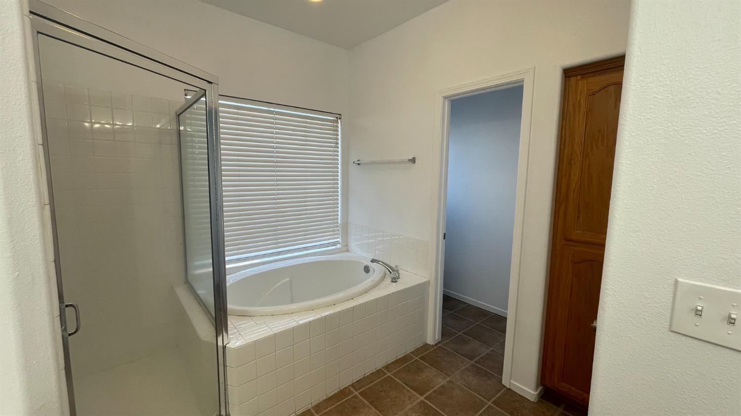 1400 Bay Street Lemoore, CA 93245 - Photo 15 of 21 a bathroom with a bathtub and shower